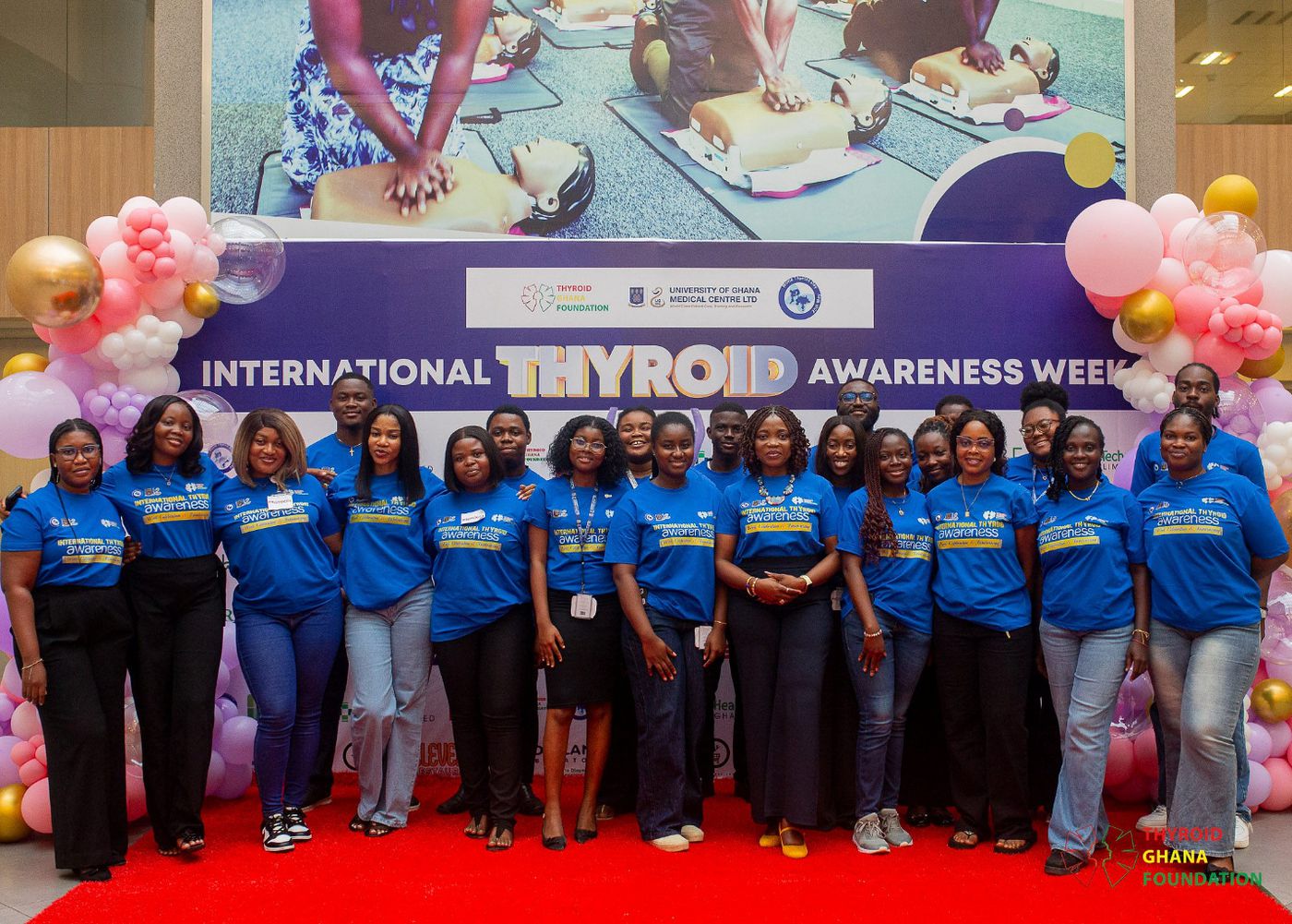 The volunteers and organising team in matching blue awareness-week t-shirts.